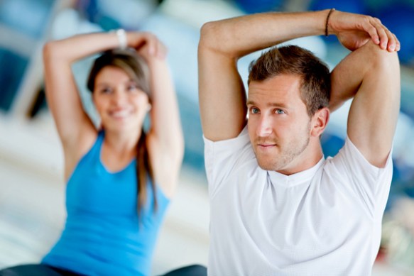 Gym people stretching